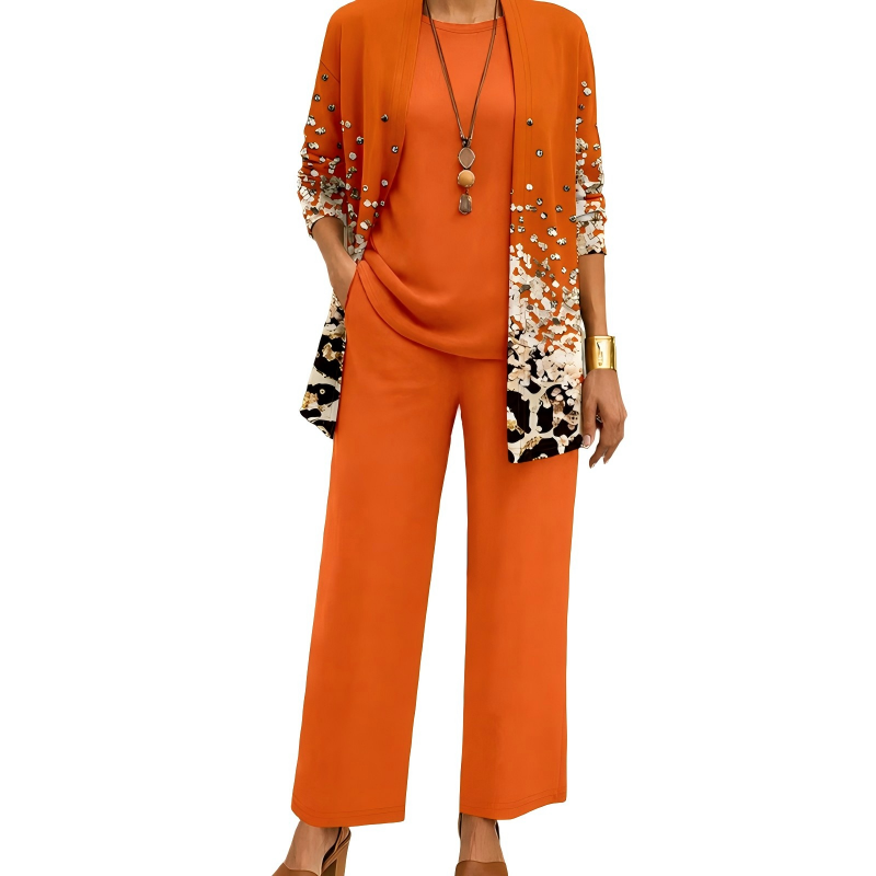 Set in oranje met cardigan met stippen- en luipaardachtige print aan de zoom, effen shirt en wijde broek. 3