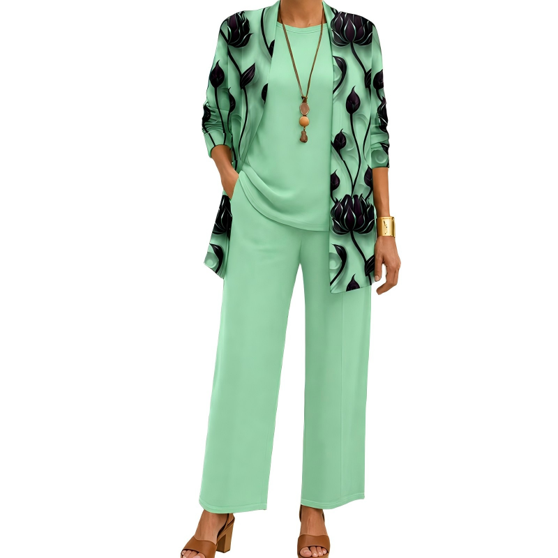 Set in mintgroen met donkere bloemenprint op de cardigan, effen shirt met ronde hals en wijde broek. 6