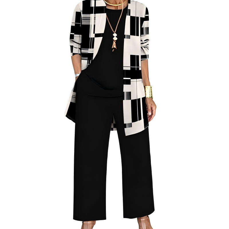 Zwart-witte set: cardigan met grafische blokkenprint, zwart shirt met ronde hals en zwarte wijde broek. 8