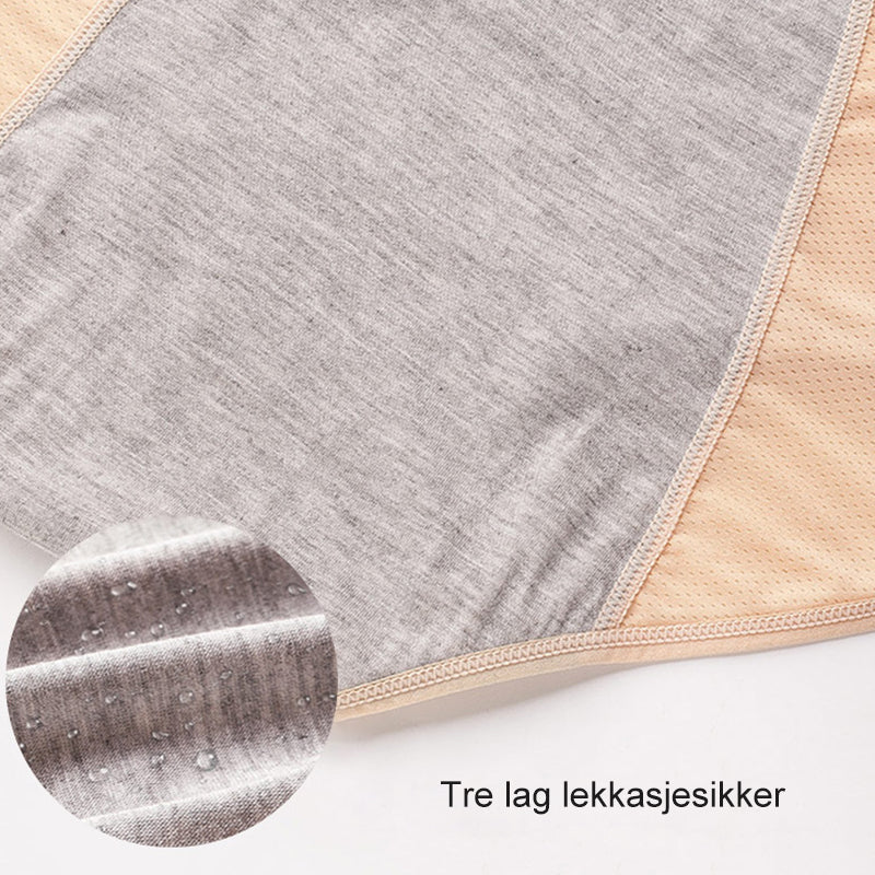 Close-up van het grijze middenpaneel in een beige slip, met een ingezoomd cirkeltje van de stof waarop waterdruppels liggen. 12